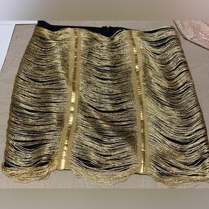 Black mini skirt with gold detail